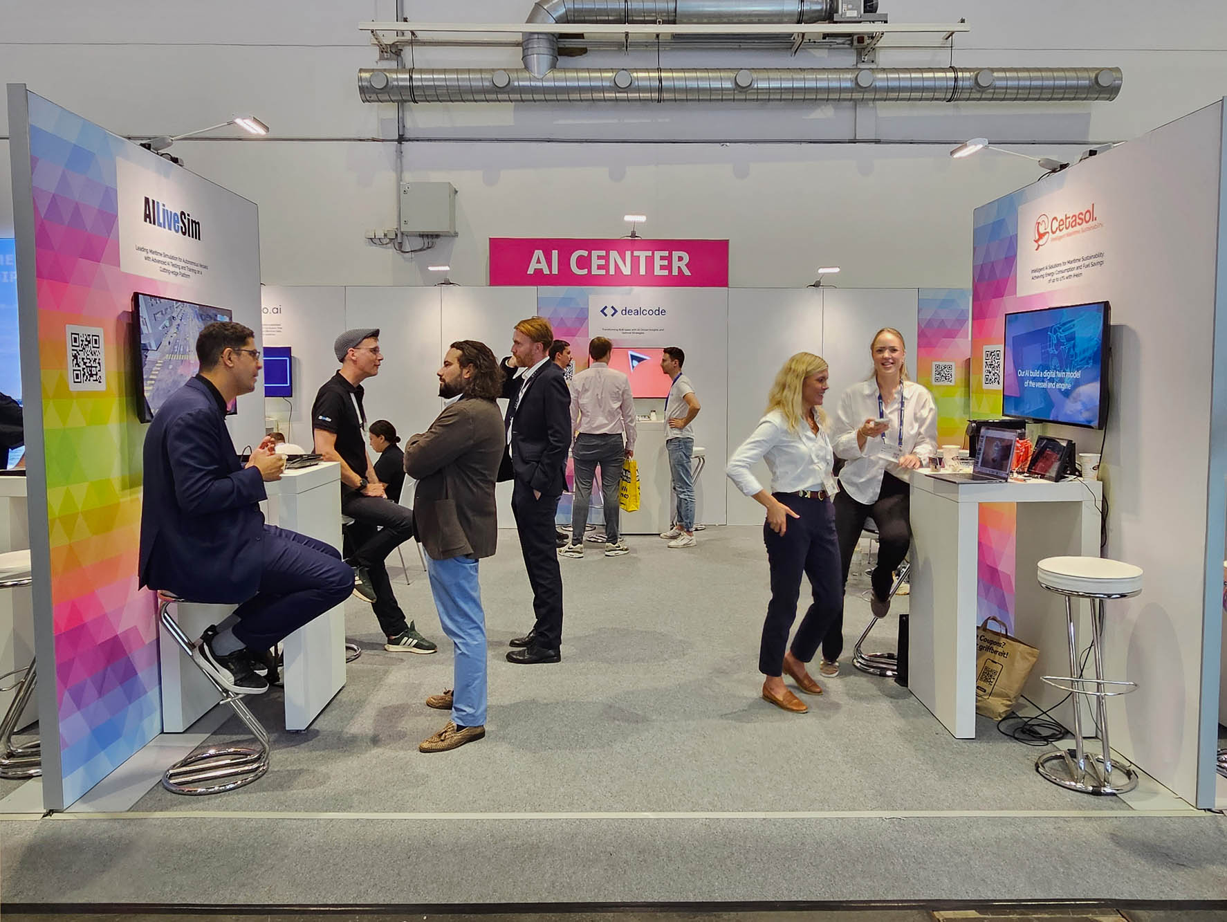 AI Center exhibition stand with several people in conversation